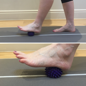 Rolling a ball on the sole of the foot to release tension in the plantar fascia